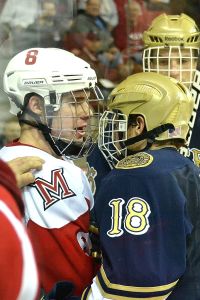 Matthew Caito confronting a Notre Dame player as a freshman (photo by Cathy Lachmann).
